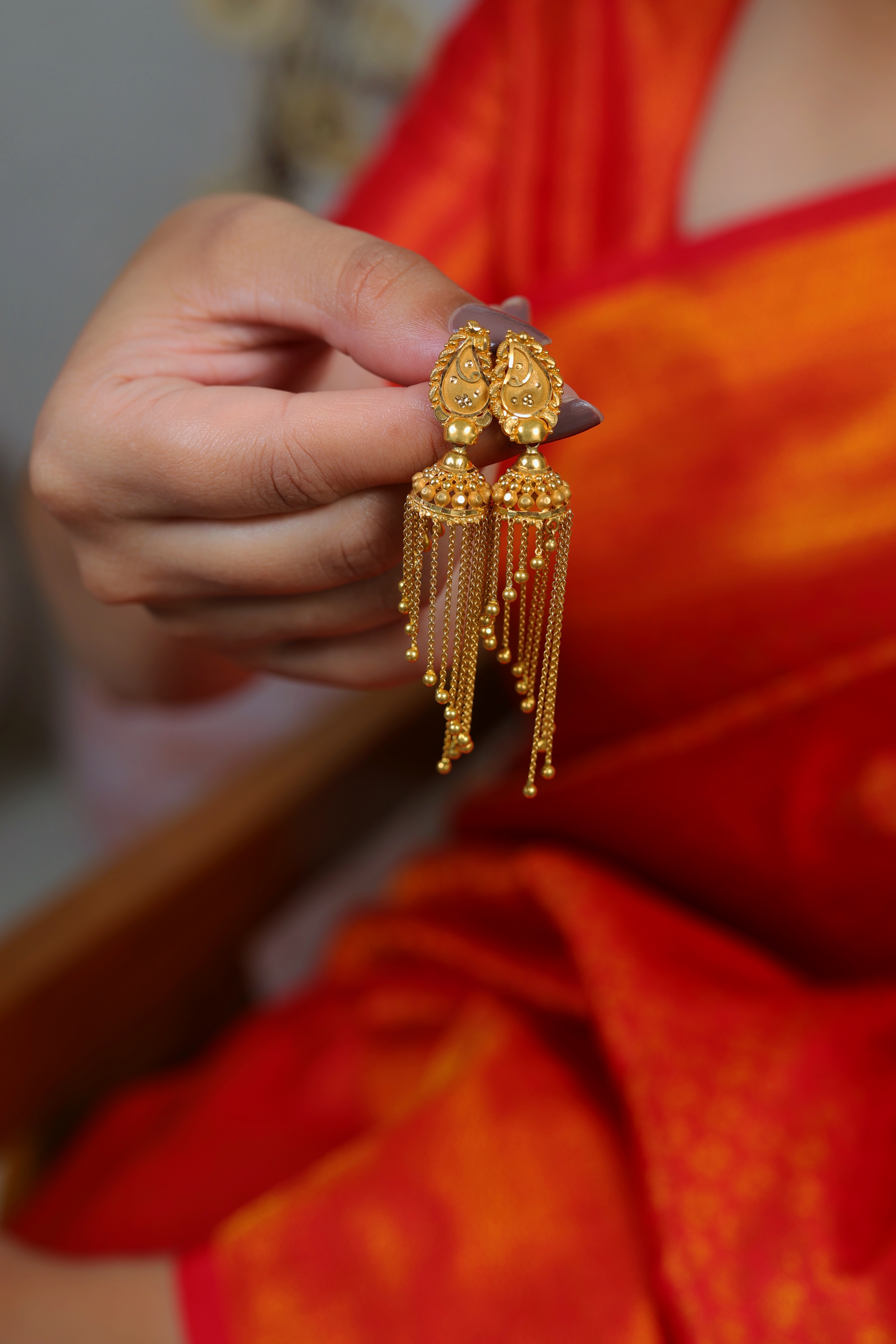Traditional Gold Jhumki Earrings with Multi-Layered Chain Tassels