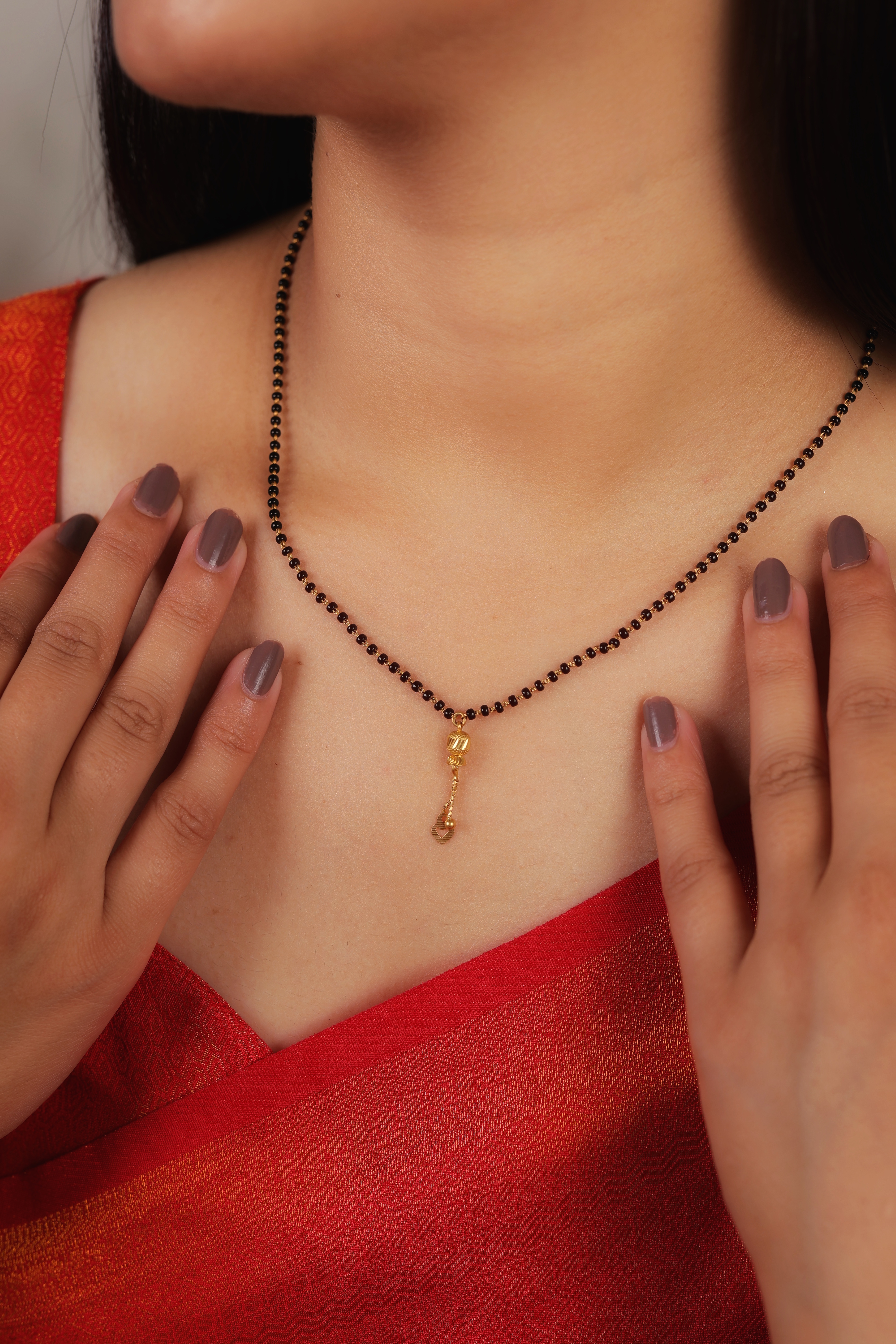 Minimalist Single-Strand Short Mangalsutra with Textured Filigree Orb and Heart Droplet