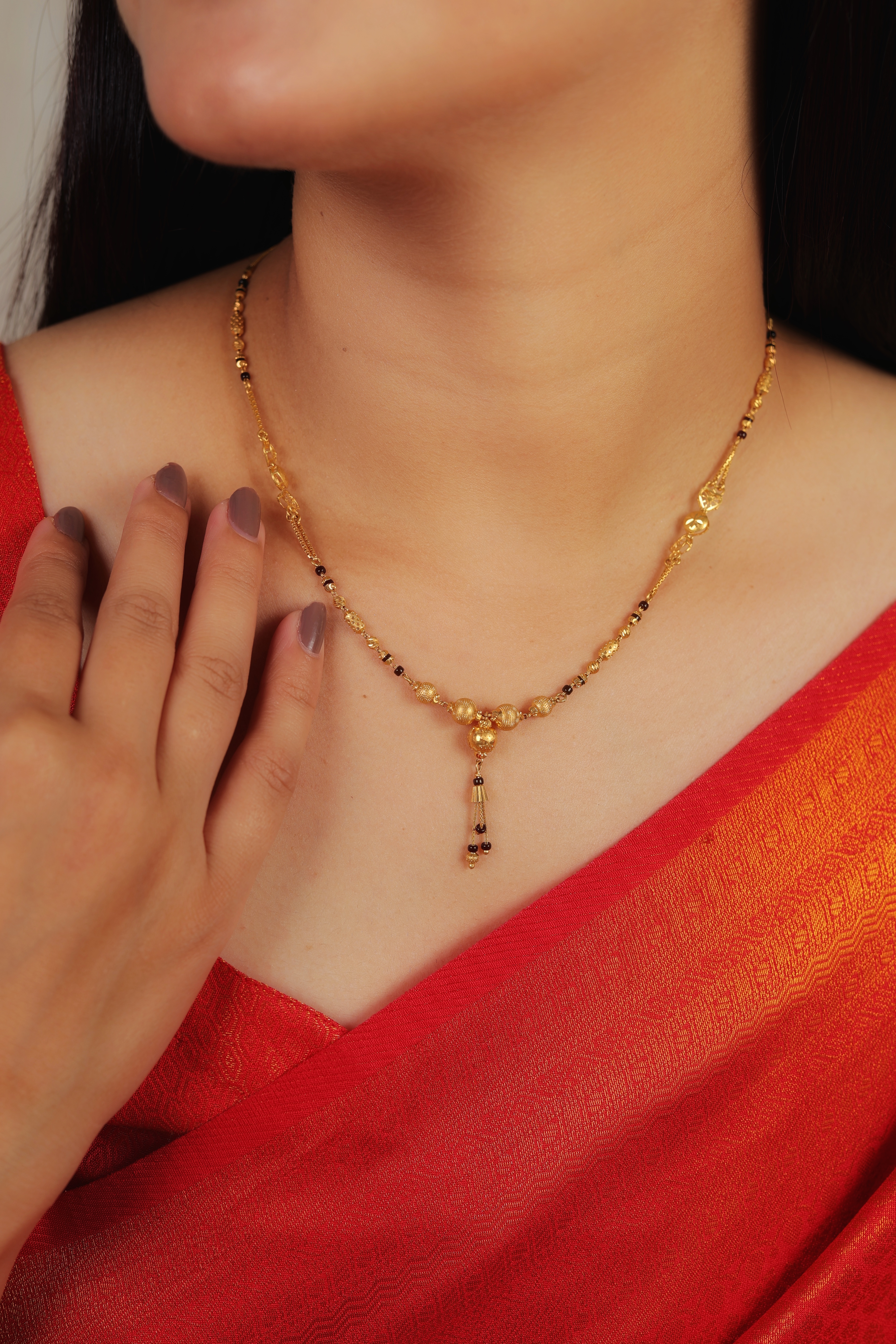 Opulent 22K Gold Short Mangalsutra with Textured Orbs and Multi-Bead Tassel