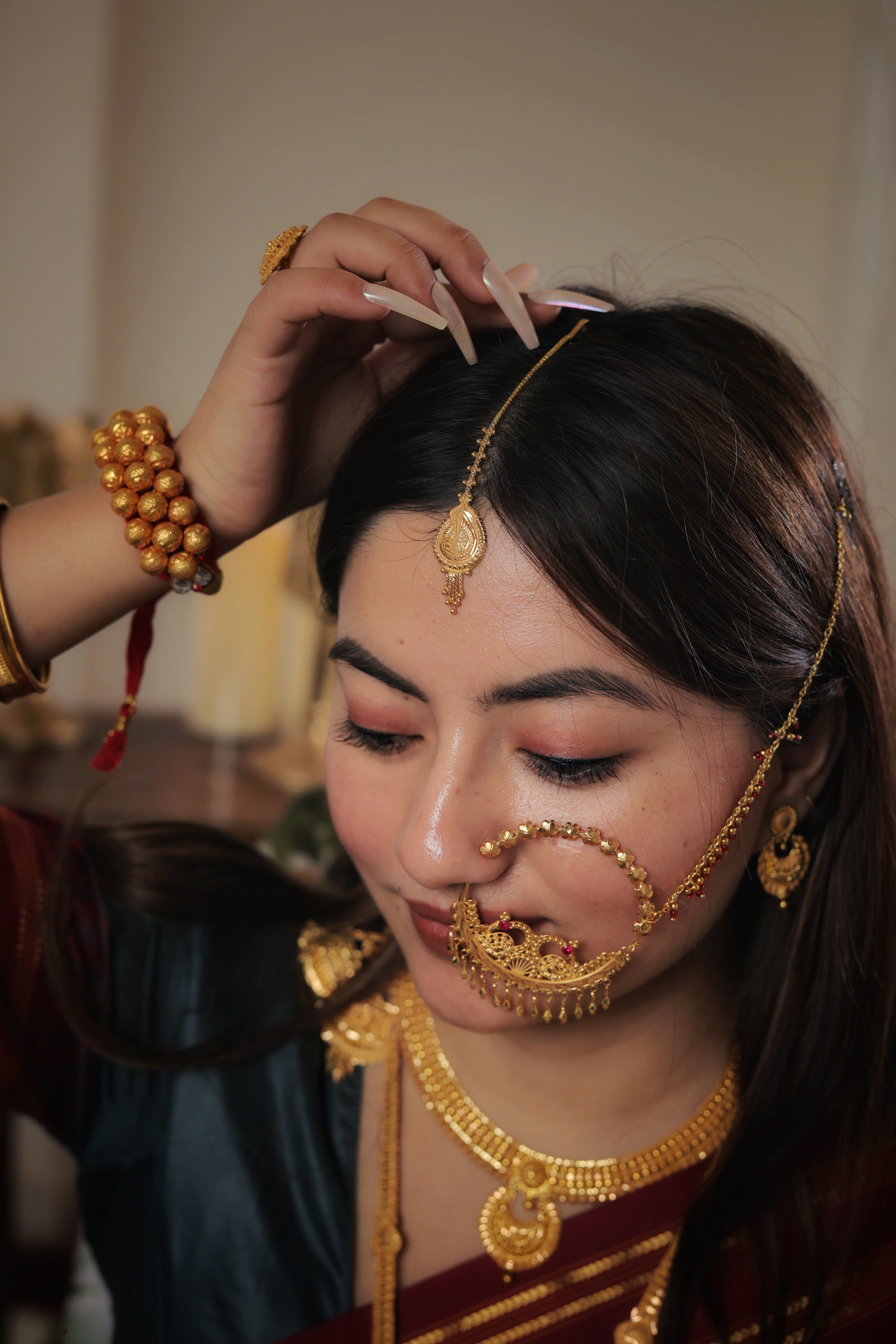Ornate 22K Gold Teardrop Maang Tika with Intricate Radial Filigree and Tassel Detailing
