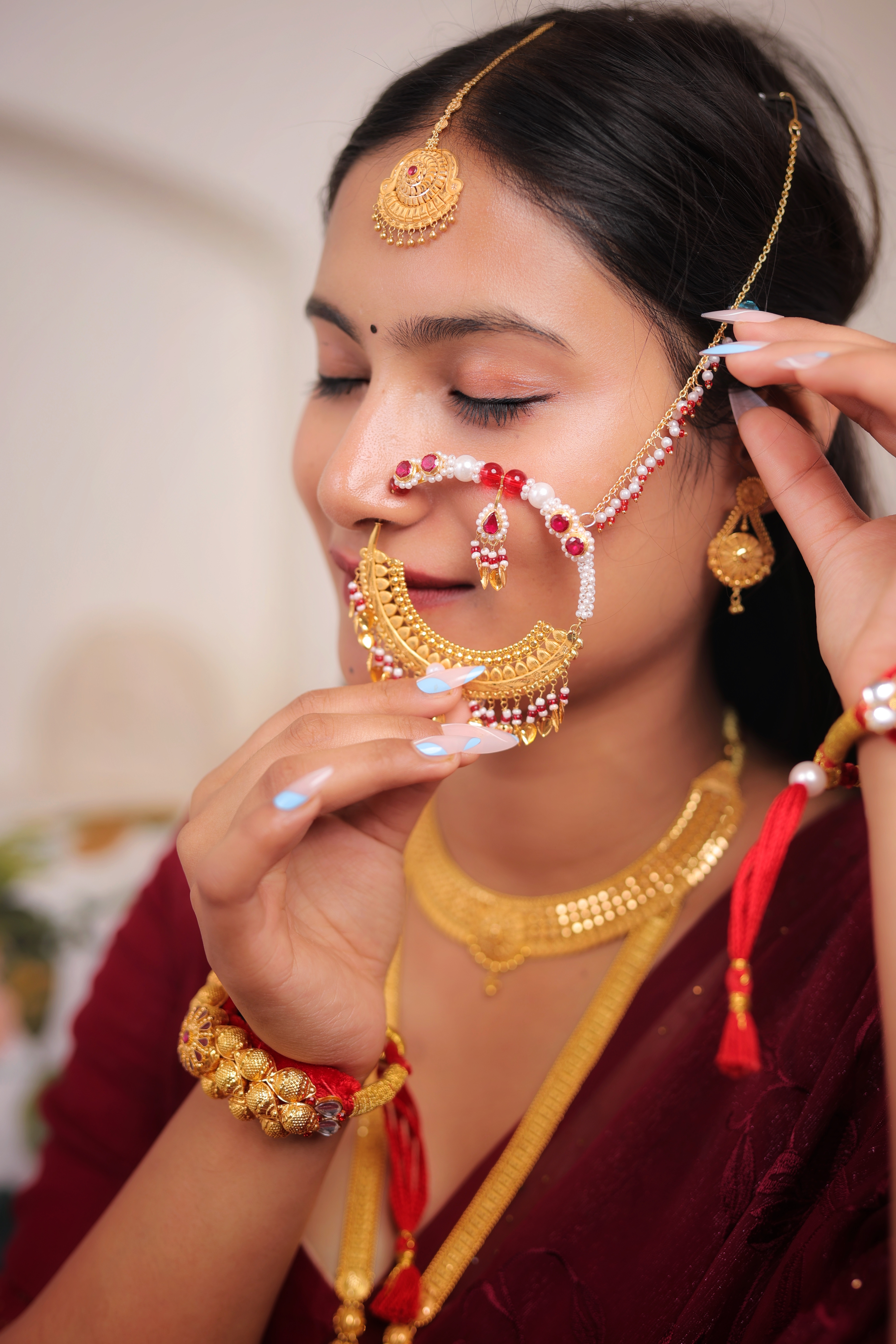 Traditional Gold Nath – Maharashtrian Bridal Nose Ring with Pearl & Red Stone Work
