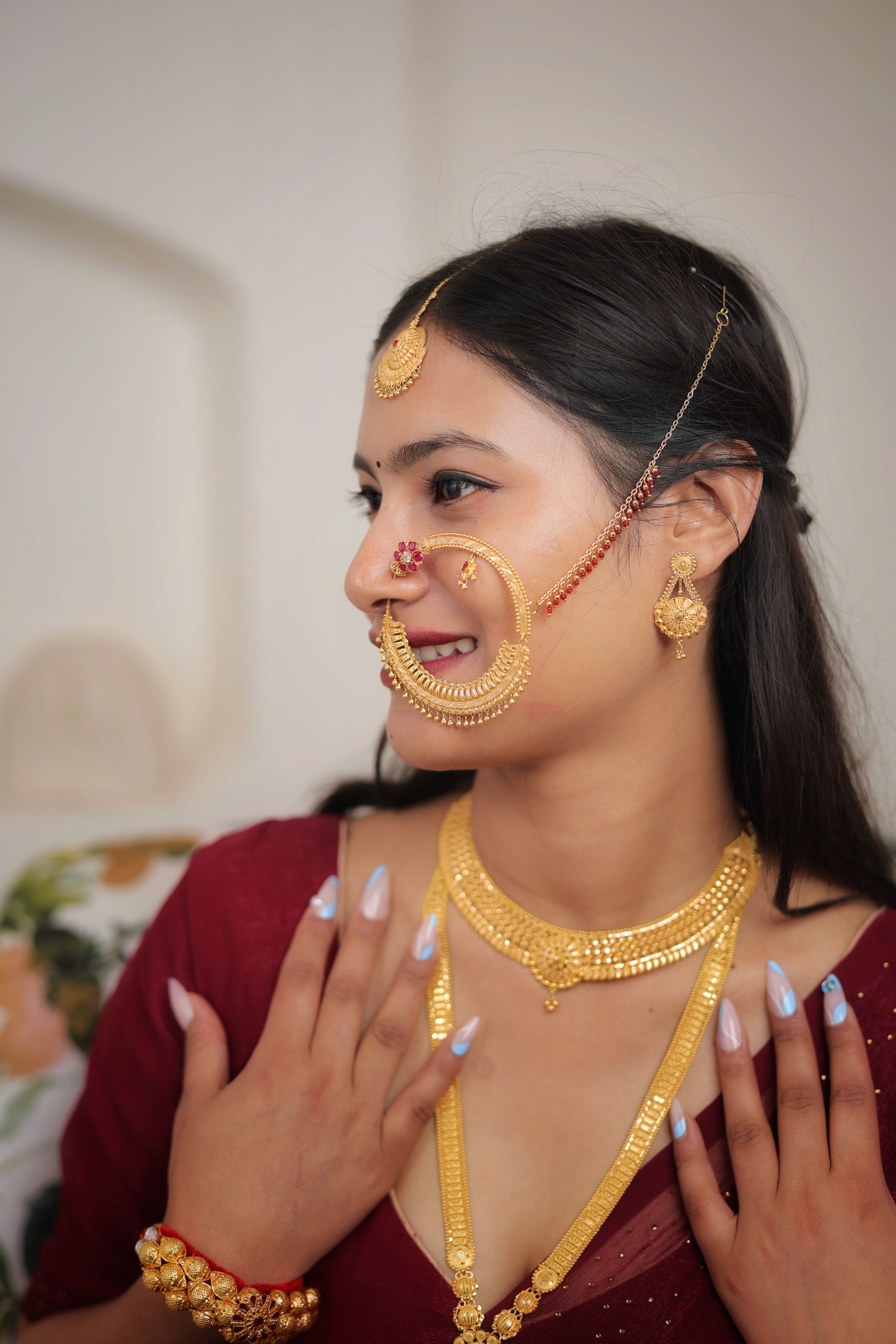 Traditional Bridal Gold Nath – Crescent Nose Ring with Red Stone & Pearl Detailing